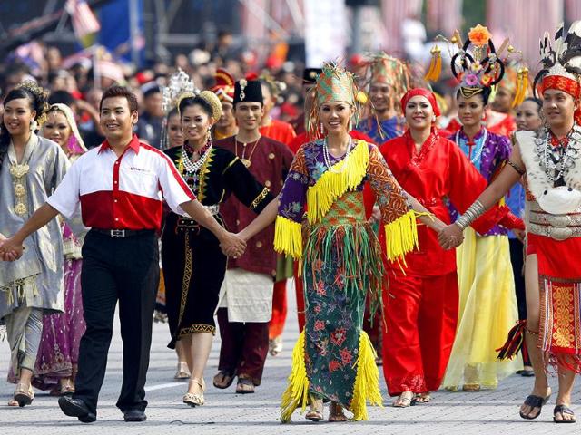 Malaysian dancers in traditional costumes perform during Malaysia Day celebrations at Independence Square in Kuala Lumpur, Malaysia.