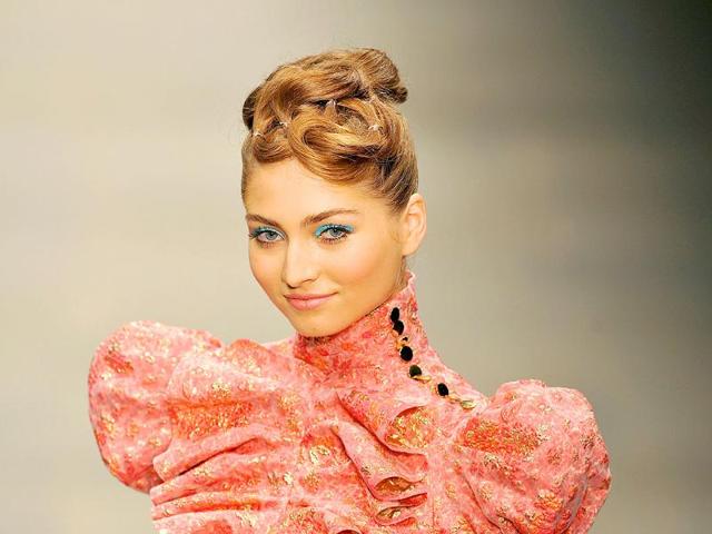 A model wears a creation by British designer Paul Costelloe during his Spring/Summer 2012 collection show, on the first day of the London Fashion Week in London. 