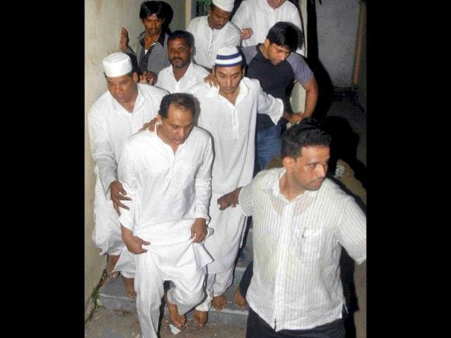 Cricketer-turned politician Mohammad Azharuddin with family and relatives during funeral procession of his son Mohammad Ayazuddin who died in Hyderabad.