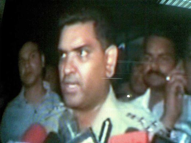 A senior UP police officer briefs the media out side the blast site at Jai hospital in Agra.