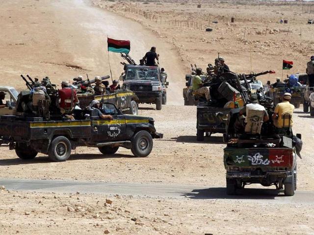 Anti-Gaddafi fighters drive towards Sirte, the hometown of deposed leader Muammar Gaddafi. Libyan interim government National Transitional Council (NTC) forces advanced on Sirte on Libya's central Mediterranean coast but Gaddafi loyalists are holding out, a day after NTC forces captured the city's airport on its outskirts.
