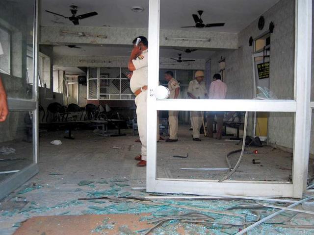 Police officers investigating the site of explosion at Jai hospital in Agra.