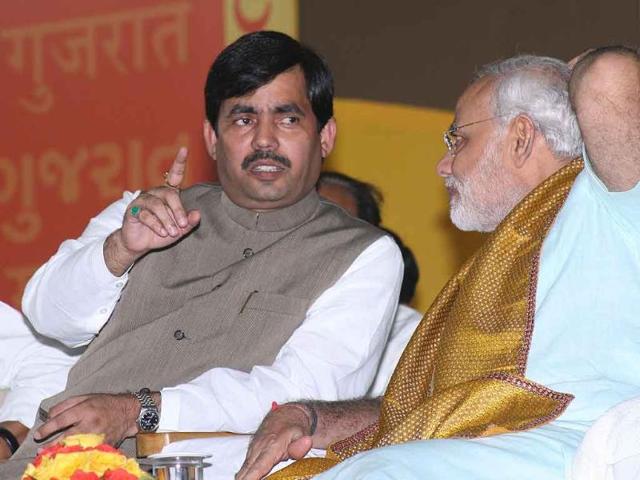 Gujarat chief minister Narendra Modi, with BJP leader Shahnawaz Hussain, on the second day of his 72 hour fast at the Gujarat University convention hall in Ahmedabad.