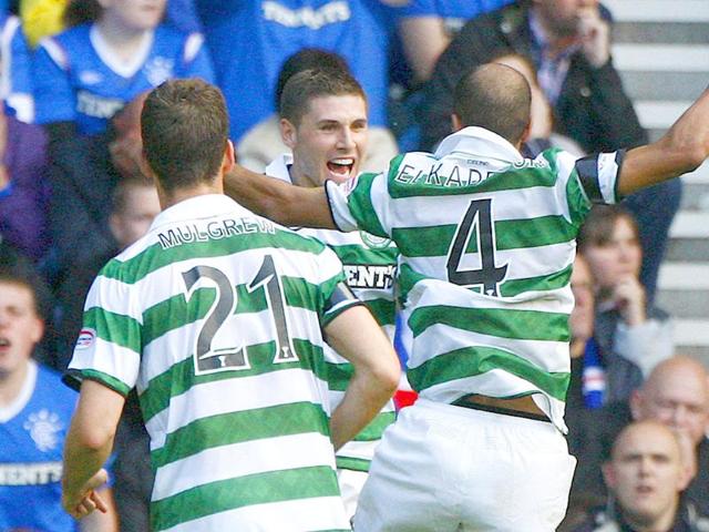 Celtic's Gary Hooper (C) celebrates with his teammates after scoring his second goal against Rangers during their Scottish Premier League 'Old Firm' soccer match at Ibrox stadium in Glasgow, Scotland.