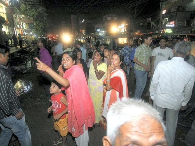Panic gripped people stand outside their houses after an earthquake occurred in Patna. An earthquake of 9 intensity measuring 6.8 on Richter Scale with its epicenter on the Sikkim-Nepal border shook northeast and northern parts of the country, including the national capital.