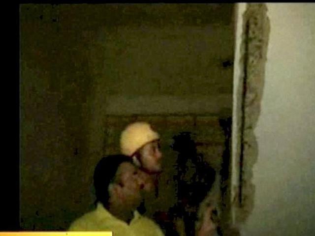 **TV GRAB** Fire personal showing crack wall, after an earthquake occurred in Kolkata. An earthquake of 9 intensity measuring 6.8 on Richter Scale with its epicenter on the Sikkim-Nepal border shook northeast and northern parts of the country, including the national capital.