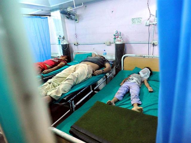 Dead body of Bir Bahadur Majhi (L), 36-year old Sajan Shrestha (C) and 8-year old Asmita Shrestha lie on medical gurneys and beds in a hospital after a British Embassy wall collapse during an earthquake in Kathmandu.