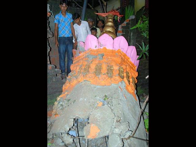 Peoples gather near a damaged temple minaret after an earthquake occurred in Siliguri. An earthquake of moderate intensity measuring 6.8 on Richter Scale with its epicenter on the Sikkim-Nepal border shook northeast and northern parts of the country, including the national capital, this evening.