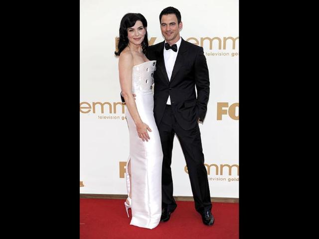 Julianna Margulies, left, and Keith Lieberthal arrive at the 63rd Primetime Emmy Awards. (AP)