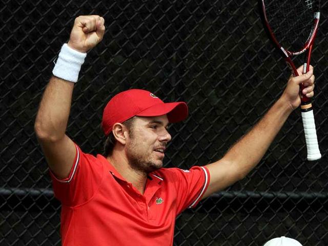Stanislas Wawrinka of Switzerland celebrates after defeating Lleyton Hewitt of Australia in the fifth and final match of their Davis Cup world group play-off tie in Sydney.