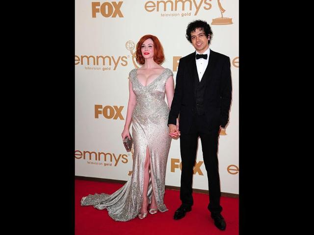 Actress Christina Hendricks and husband Geoffrey Arend arrive at the 63rd annual Primetime Emmy Awards. (AFP)