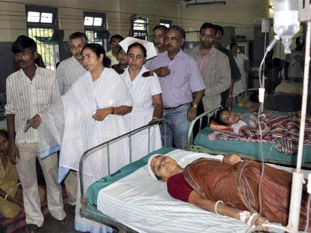 West Bengal chief minister Mamta Banerjee visits people injurered in Sunday's earthquake at a hospital in Siliguri.