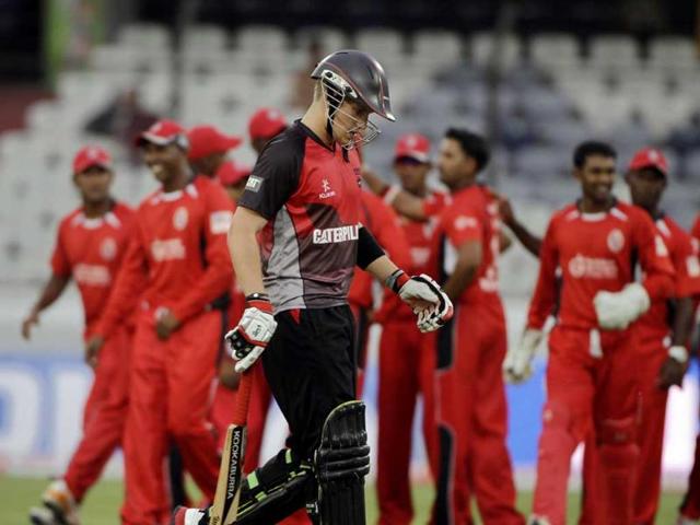 Leicestershire player Joshua Cobb walks towards the pavilion after being dismissed by Ravi Rampaul during the Champions League Twenty20 qualifying match between Leicestershire and Trinidad and Tobago in Hyderabad.