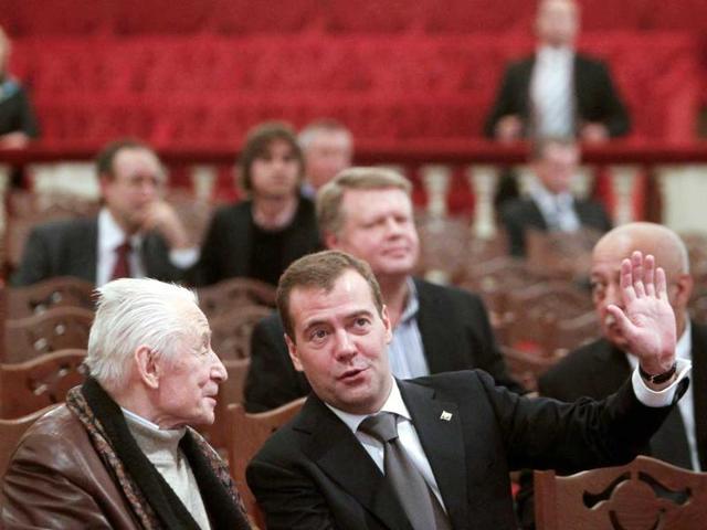 Russia's President Dmitry Medvedev (R) talks to famous choreographer Yury Grigorovich as he visits the Bolshoi Theatre.
