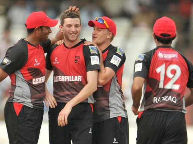 Leicestershire Foxes bowler Harry Gurney (2L) celebrates with teammates after taking the wicket of unseen Ruhunu captain Mahela Udawatta during the Champions League Twenty20 League qualifying pool cricket match between Ruhunu XI and Leicestershire Foxes at The Rajiv Gandhi International Stadium in Hyderabad.