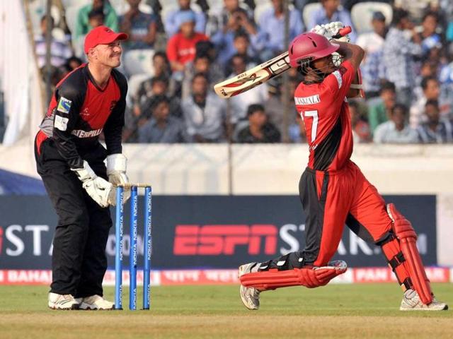 Ruhunu XI batsman Dinesh Chandimal plays a shot during the Champions LeagueTwenty20 League qualifying pool cricket match between Ruhunu XI and Leicestershire Foxes at the Rajiv Gandhi International Stadium in Hyderabad.