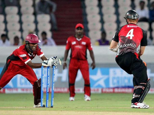 Leicestershire Foxes batsman McDonald is stumped by Ruhunu Eleven wicketkeeper Chandimal during the Champions League T20 match between Leicestershire Foxes and Ruhunu Eleven at Rajiv Gandhi International Cricket stadium at Hyderabad.