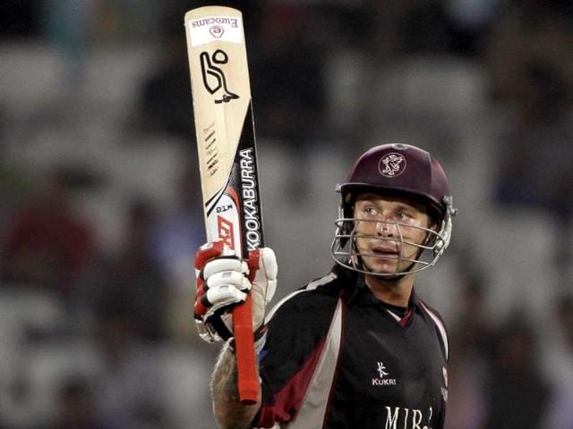 Somerset batsman Peter Trego raises his bat after his fifty runs during the Champion League Twenty20 qualifying match between Kolkata Knight Riders and Somerset in Hyderabad.
