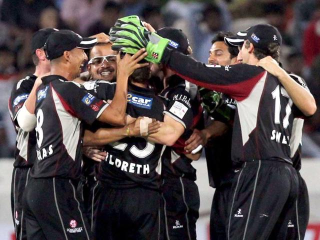Somerset bowler Murali Kartik celebrates with teammaes the wicket of KKR batsman Jack Kallis during the Champions League T20 match between Kolkata Knight Riders and Somerset at Rajiv Gandhi International Cricket stadium in Hyderabad.
