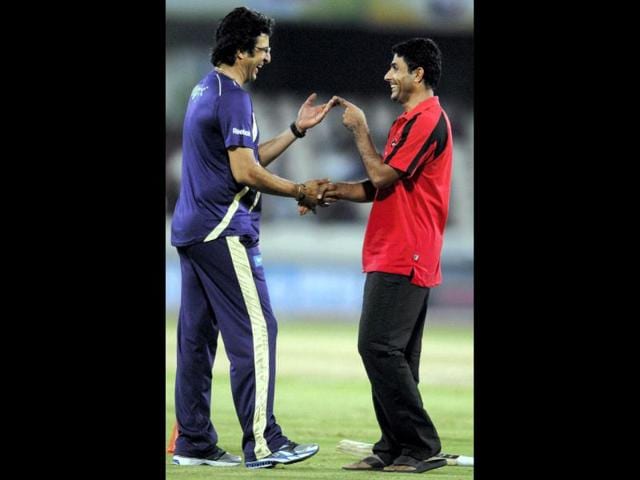 Wasim Akram and A Razzak share a light moment before the start of the match between, Somerset and Kolkata Knight Riders at Champions League Twenty20, Qualifying Tournament in in Hyderabad.