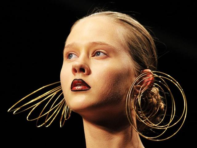 A model displays a creation by KTZ, during a Spring/Summer 2012 collection fashion show on the final day of the London Fashion Week in London.