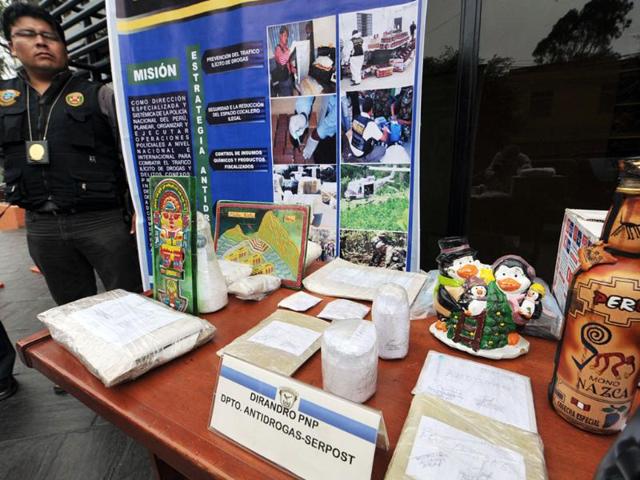 A display about drug smuggling modalities during a presentation to the press by the Anti Drug Division of the Peruvian National Police in Lima following the capture of thirty-seven people and the seizure of more than a ton of cocaine and derivates and 39 tons of a variety of supplies for its elaboration.