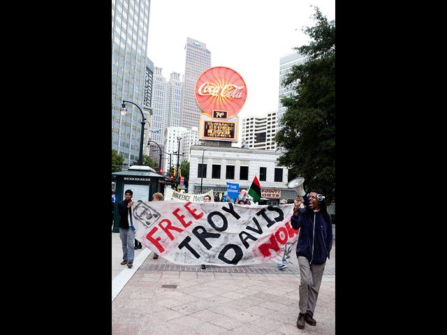 Protesters for Troy Davis walk through downtown Atlanta before gathering on the steps of the Georgia Capitol building. The Georgia Board of Pardons and Paroles denied clemency for death row inmate Troy Davis on Tuesday morning.
