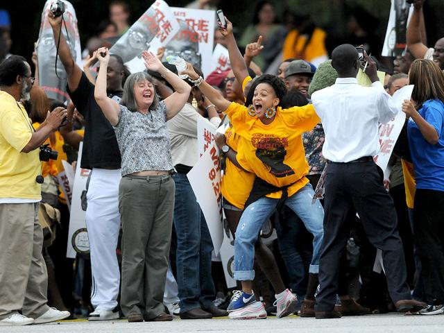 Demonstrators react after an apparent delay in the scheduled execution of convicted cop killer Troy Davis at the Georgia Diagnostic and Classification Prison in Jackson, Georgia. Davis was scheduled to die today for the 1989 murder of a Savannah police officer, although his supporters contend several witnesses have recanted their trial statements.