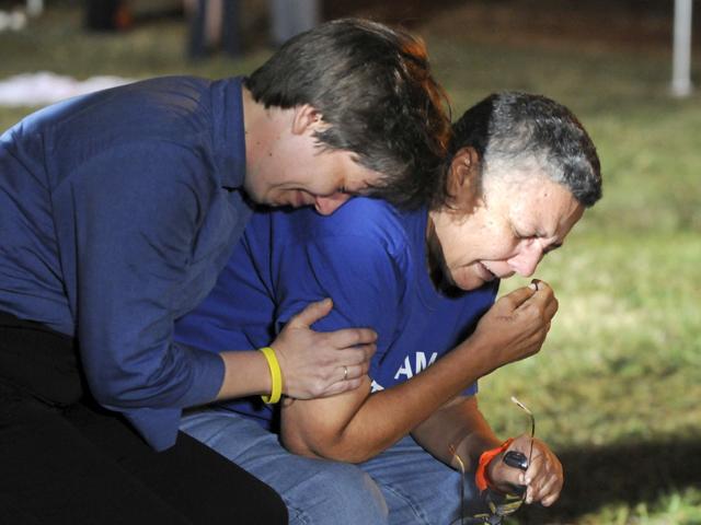 Minister Lynn Hopkins (L) consoles her partner Carolyn Bond after a last minute US Supreme Court appeal was denied at the Georgia Diagnostic and Classification prison where convicted killer Troy Davis is set to be executed by lethal injection in Jackson, Georgia.