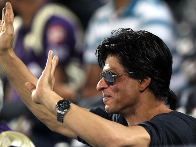 Shah Rukh waves to his fans from the pavillion.