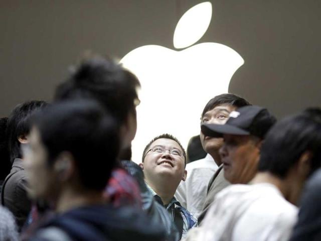 People attend the inauguration of the new Apple store in Nanjing Road, downtown Shanghai.