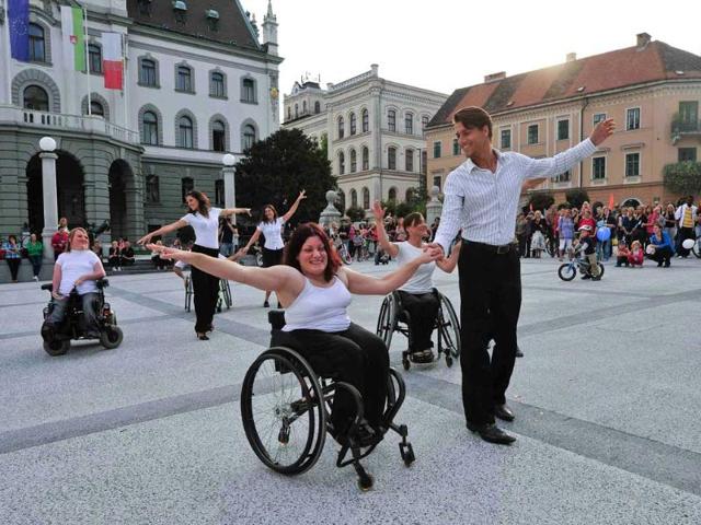 Dancers in wheelchairs perform during European Mobility Week in Ljubljana's main square.