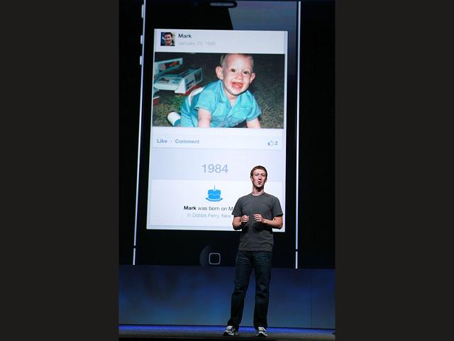 Facebook CEO Mark Zuckerberg shows a photo of himself as a baby as he delivers a keynote address during the Facebook f8 conference. Facebook CEO Mark Zuckerberg kicked off the conference introducing a Timeline feature to the popular social network.