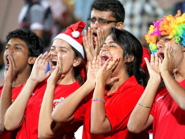 RCB fans cheer during the match of Champions league T20-2011 in Bangalore.