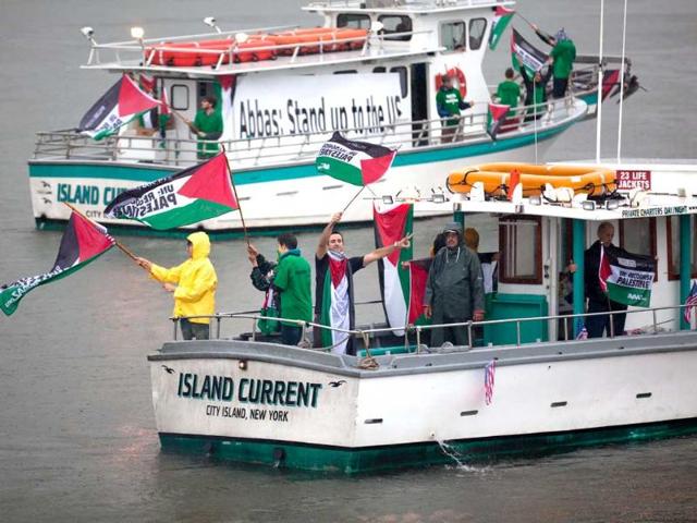Members of Avaaz, a global campaign organisation, take to the East River in boats to demonstrate for Palestinian statehood outside the UN headquarters in the Manhattan borough of New York.