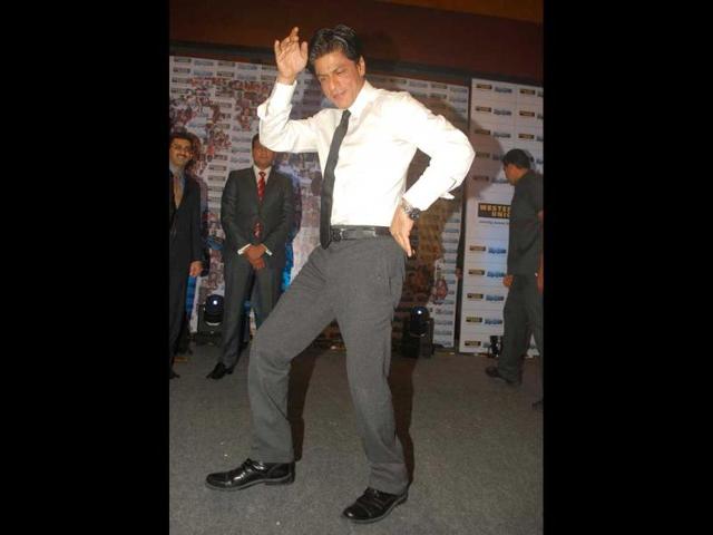 Shah Rukh Khan performing on a song from his film RA.One during the promotional event.