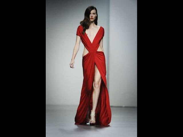 Red carpet glamour! A model flaunts her curves in this designer gown.