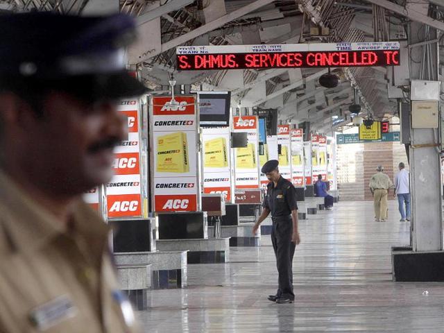 Security personnel stand guard at a deserted railway station during a 48-hour railway strike demanding the creation of the state of Telangana, in Hyderabad.