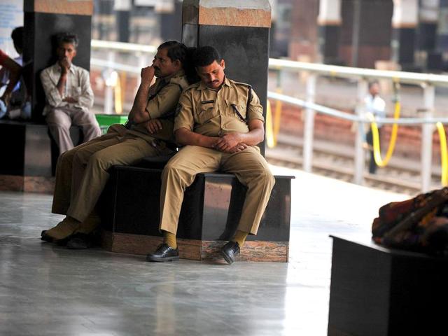 A policeman naps on the platform on a railway station during a 48-hour railway strike in the Telangana region in Hyderabad.