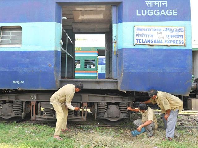 Railway technicians inspect an Express train coach during a 48-hour railway strike in the Telangana region in Hyderabad.