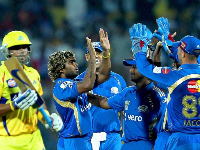 Mumbai Indians' players celebrating the wicket of Murali Vijay during the Champions league T20-2011 match at MAC Stadium in Chennai.