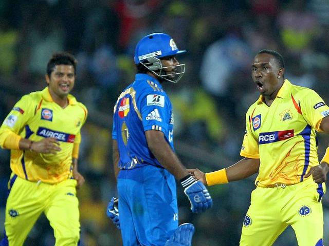 Chennai Super Kings' players celebrating the wicket of Ambati Rayudu during the Champions league T20 match at MAC Stadium in Chennai.