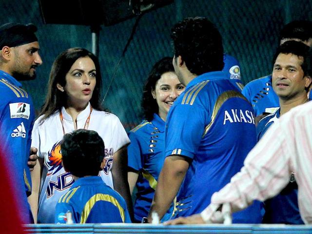 Mumbai Indians' owner Nita Ambani with Sachin Tendulkar and Harbhajan Singh after their win against Chennai Super Kings during the Champions league T20 match at MAC Stadium in Chennai.