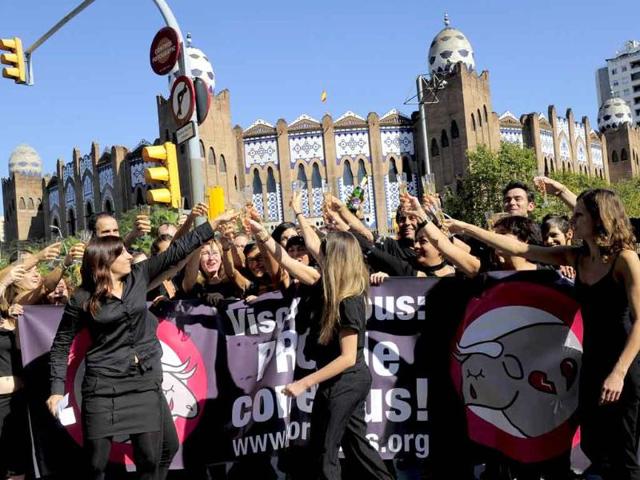 'Animal Naturalis' activists toast during a protest against bullfighting and celebrating the last "corrida" that will take place. September 25th 2011 will mark the end of bullfighting in the Catalan region as the combat has been officially banned for good in the region.