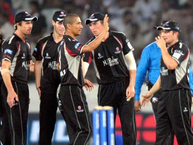 Somerset celebrates the dismissal of KKR batsman MK Tiwary during their Champions League Twenty20 match in Hyderabad.