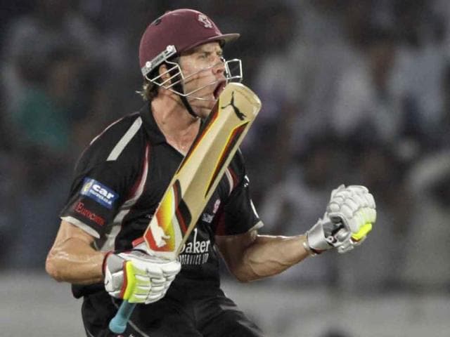 Somerset batsman Nick Compton celebrates his winning shot against Kolkata Knight Riders at the Champions League Twenty20 cricket match in Hyderabad.