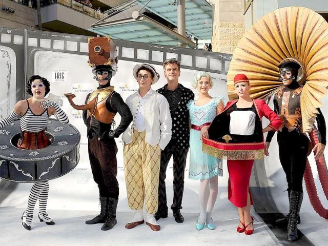 Director Philippe Decoufle (C) and performers attend IRIS, A Journey Through the World of Cinema by Cirque du Soleil premiere in Hollywood, California.