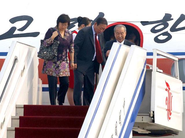 North Korea's Premier Choe Yong Rim (R) arrives at the airport in Beijing, China.