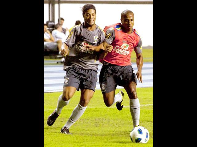 Brazil's Ronaldinho (L) challenges Borges during their training session at Mangueirao stadium in Belem.