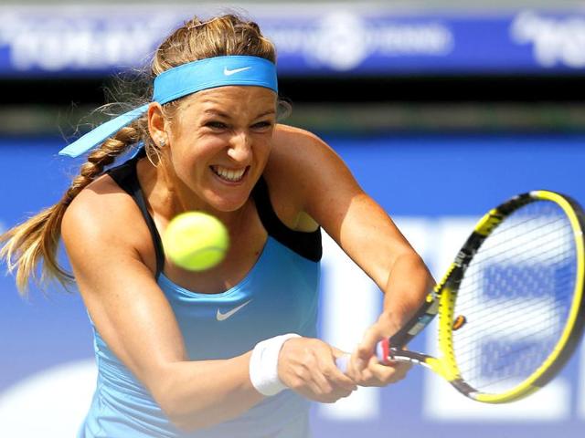 Victoria Azarenka of Belarus hits the ball to Irina-Camelia Begu of Romania during their match at the Pan Pacific Open tennis tournament in Tokyo.